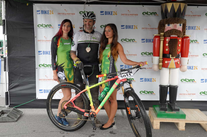 After 18:44 hours, the madness is over. Lesewitz poses with the EBM finisher girls for the traditional finish line photo.