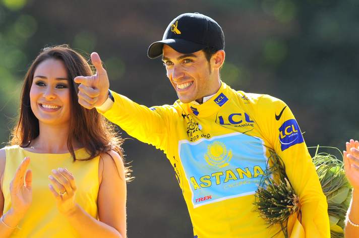 Alberto Contador with his "El Pistolero" pose at the podium ceremony in Paris.