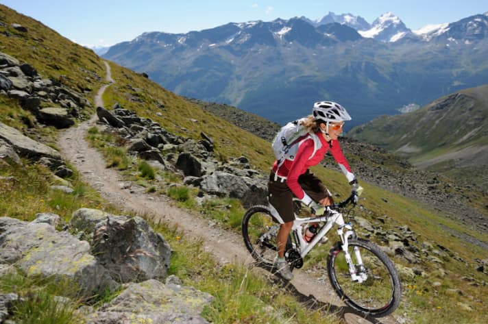   The overpass trail from the St. Moritz side around the Piz Nair into the Suvretta valley: the Bernina with Bianco ridge (4048 m) flashes in the background.