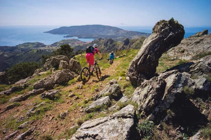   Trails lead down to Porto Azzuro, behind which, on the peninsula, is the Capoliveri "bike park".