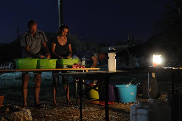   Kitchen duty: Every evening, two others have to do the washing up by candlelight. 