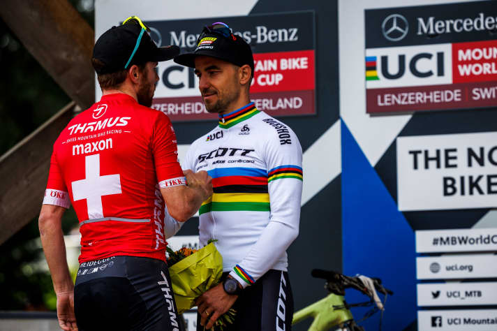 Thick air: compatriots Mathias Flückiger (left) and Nino Schurter (right) took each other out of the race in the duel for victory.