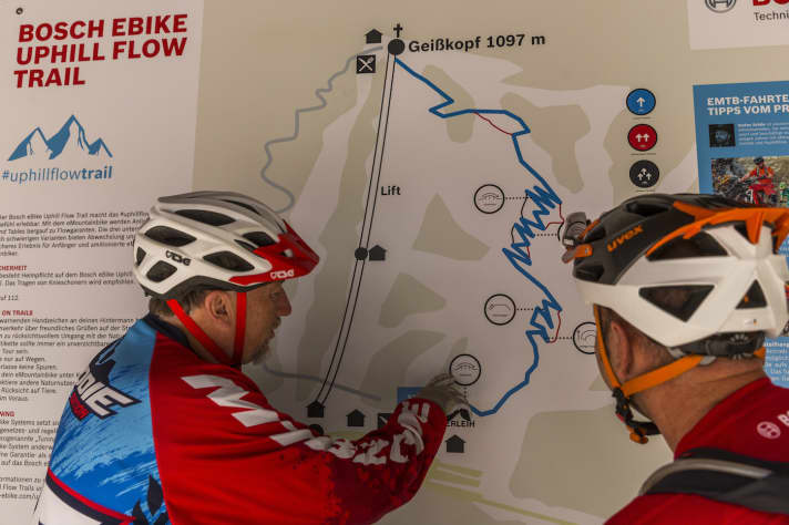   Trail builder Diddie Schneider shows the route on the map at the Geißkopf valley station.