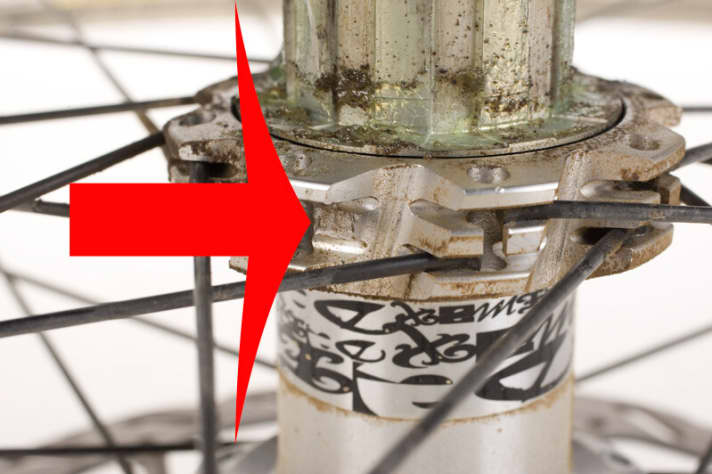   Something is missing: Spoke whole, mount torn off.