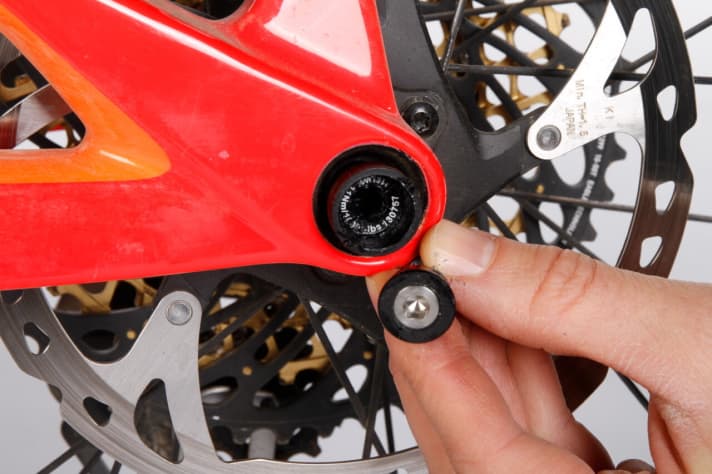   The rear thru axle is very awkward to operate and requires two screws to be turned.