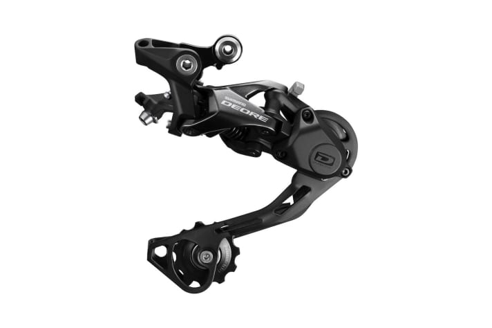   Simpler and less elegant than an XTR or XT rear derailleur, but significantly cheaper. The new Shimano Deore M6000 rear derailleur with Shadow RD+ features.