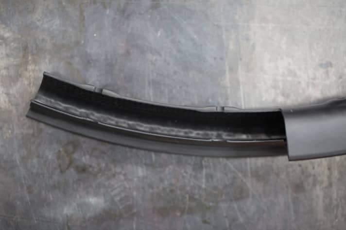   The spoke holes are reinforced on the outside, which should provide high strength with low material usage. A uniform structure with low thickness variations should ensure the advertised durability.