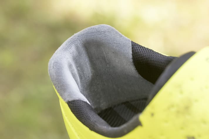   A special fabric is used to prevent heel slip. This is only partially successful when running on steep climbs.