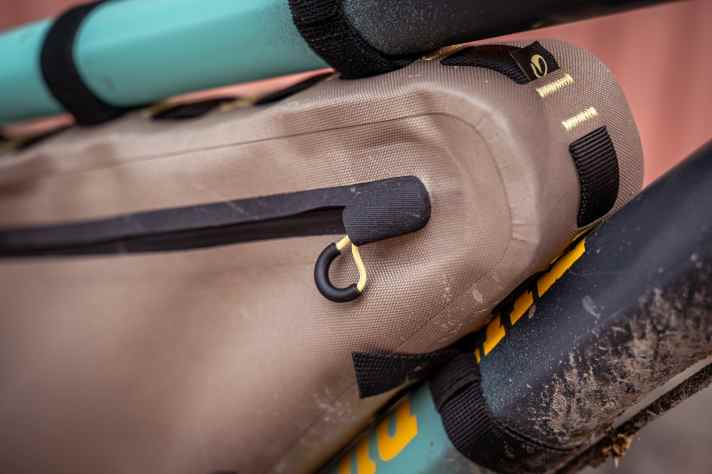 A flap prevents water from entering the zip