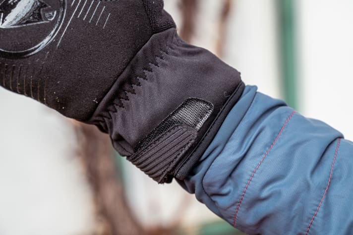 Also fits well over the jacket. However, the Velcro cuffs could open a little wider