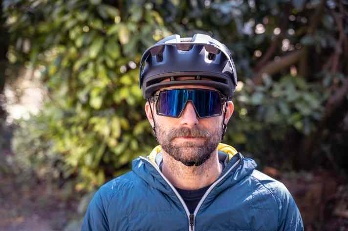 Fits well, but also a little low. This can lead to space problems with sunglasses