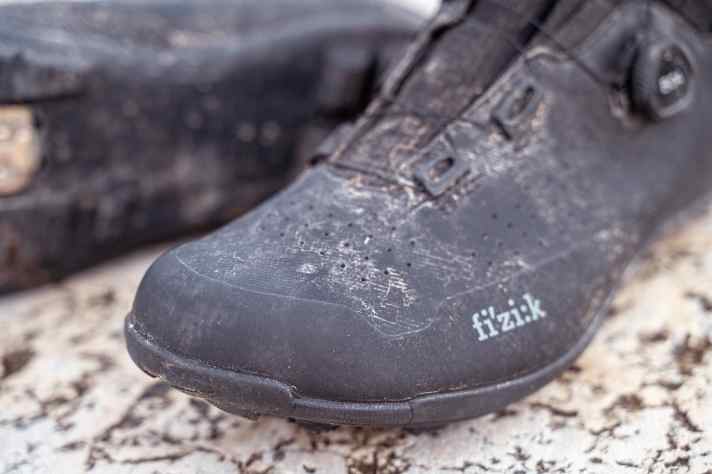 The ventilation holes are just for looks. The upper provides good protection against mud and moisture