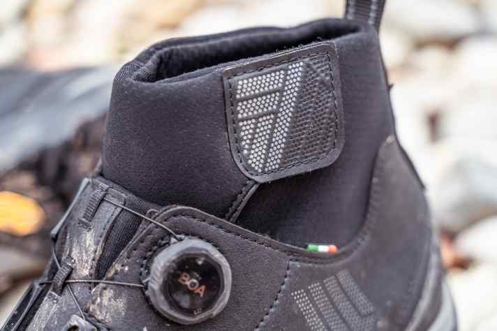 The G.Ice is definitely waterproof, but the Velcro flap could be a little higher so that it disappears further under the long trousers