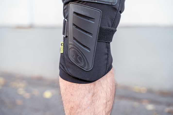The protector plate extends as far as the base of the shin bone