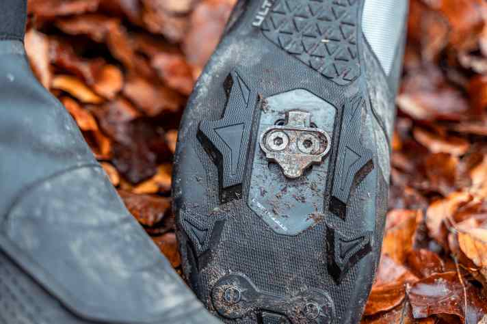 The MW7 winter shoes work great on the pedals, but if you have to push, they are more of a flop. The sole is narrow and wobbly