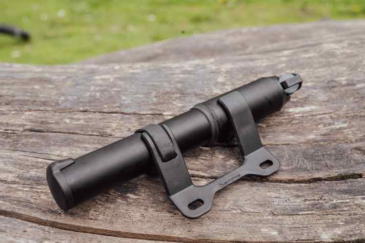 The bracket secures the cylinder and handle sleeve, which also prevents automatic extension