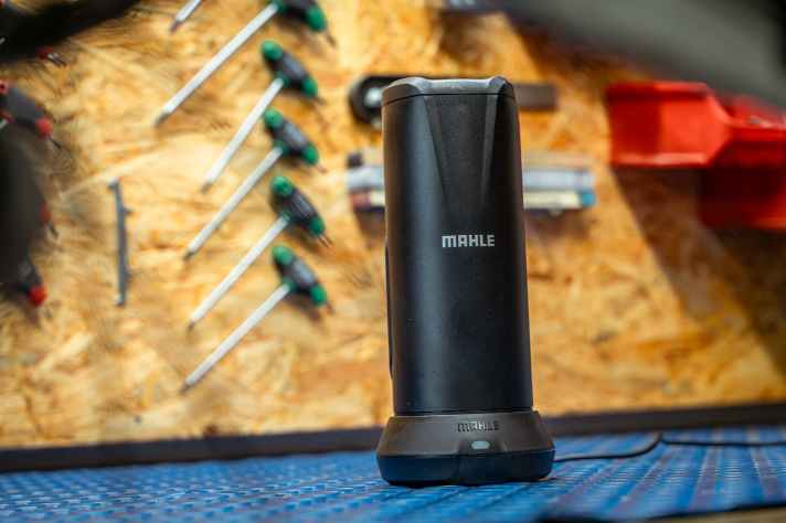 The battery is placed in the stylish charging cradle for charging