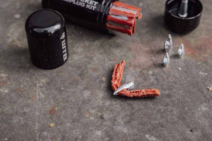 The small Rocket anchors remain stuck in the tyre like a bee sting and are designed to prevent the plug from tearing out