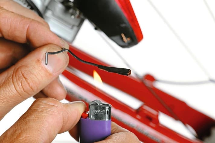 Bicycle cable lighting protection