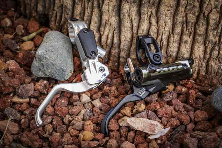 The prototype of an early Shimano disc brake next to the 2025 XTR model. Even in a good 20 years, a lot has changed technically.