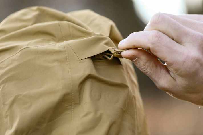 The hood can be adjusted at the back with a drawstring and small zips at the sides adjust the height.