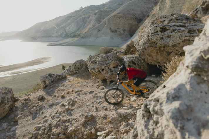 Explosive terrain: David Ponce curves through the border area on the West Bank.