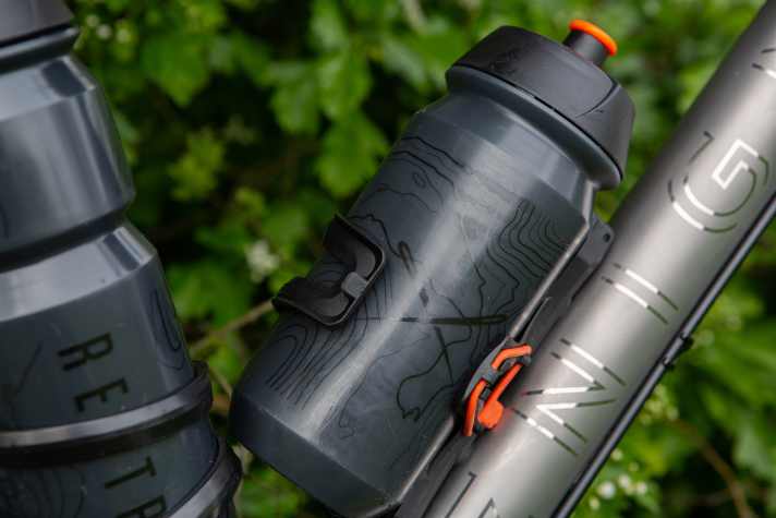 Isohypses - geographical contour lines - adorn the new Restrap bottles and the Restrap logo.