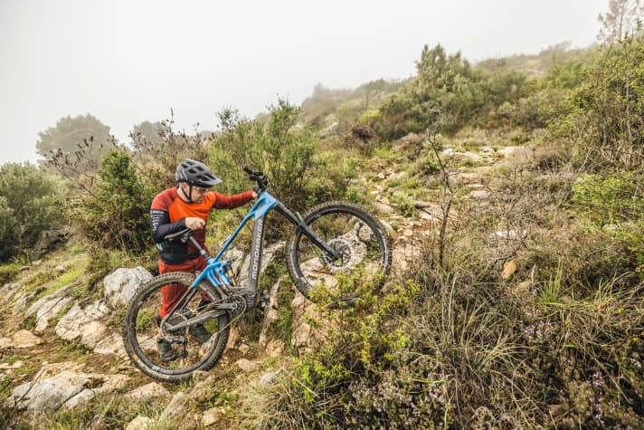 Apply controlled downward pressure with your elbow to give the rear wheel of the e-bike traction when pushing.