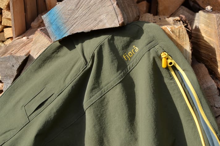 Zips run almost completely along the side seam and open mesh-backed vents.