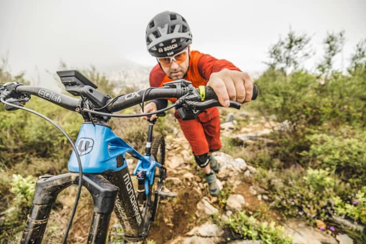 The rear brake (the left lever in the picture, but most bikers use the right!) can be used to control the speed of the pushing aid.