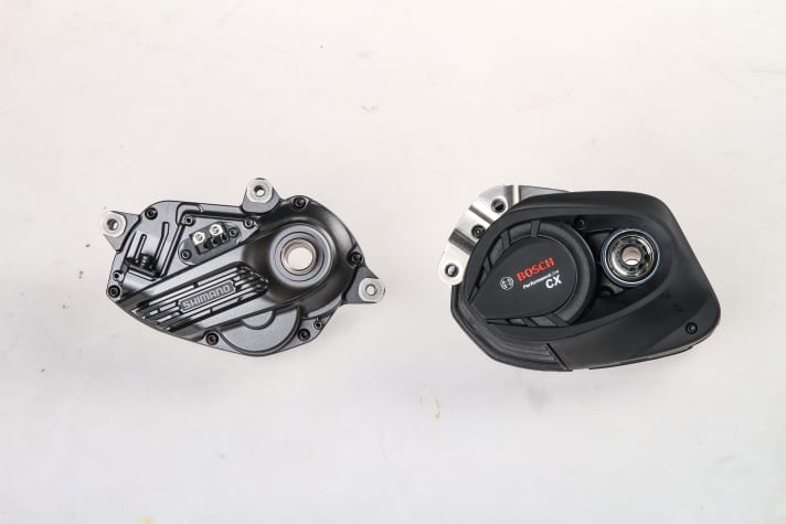   The dimensions of the two e-bike motors are not worlds apart. However, when you hold the motors in your hand, the more compact shape of the Shimano EP8 is immediately noticeable. The Shimano is slimmer towards the front/bottom in particular, which can provide more ground clearance off-road, depending on the frame construction. 