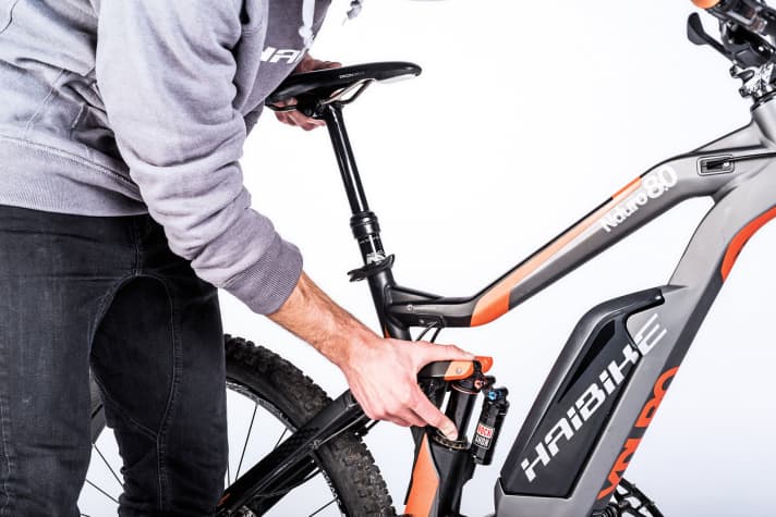    Check bushing play: If you ride a lot, your bike will eventually develop bushing play. Check the bushing play on the fork with the front brake applied and your thumb on the lower tube and stanchion. To check the bushing play on the shock (upper and lower shock mount), lift the bike up by the saddle. If it rattles, a fork or shock service by a specialist is necessary. The same applies to the dropper post.