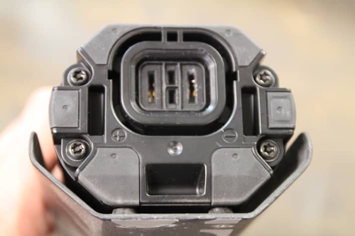   A cover that fits the respective bike or down tube is attached to the battery with four screws.