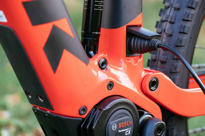   The charging socket is located under a cover cap in the bottom bracket area.