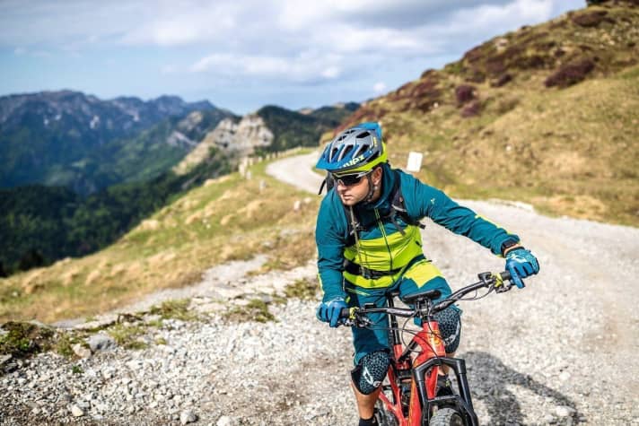 Look in the direction of travel and as far forwards as possible.