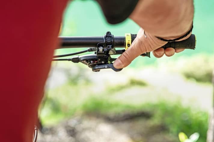   You should be able to reach the gear lever on the E-MTB handlebars with your thumb without having to reach round.