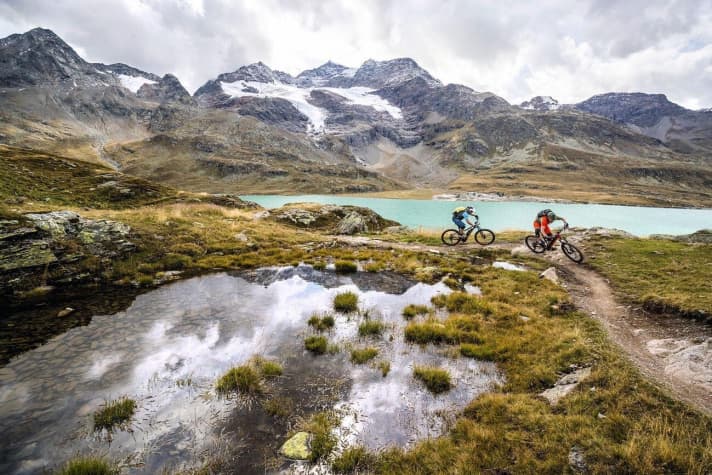   Around the lake: Another trail winds around the north-west shore of Lago Bianco. The glacier flanks of Piz Palü behind you.