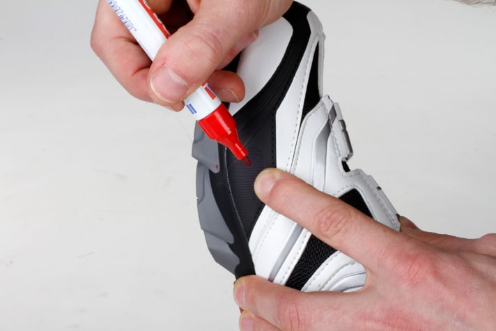   Then slip into the shoe and feel the two joints through the shoe. Now use a pen to make a mark on both sides.