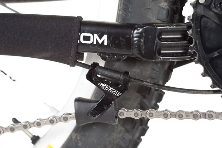   The C-Guide chain guide weighs little and works. Unfortunately, the cable tie attachment is not really durable and tears off quickly.