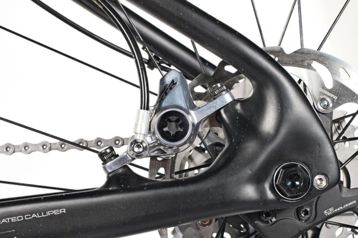   The rear brake callipers are located between the seat tube and chainstay on both bikes. This gives them a little more protection.