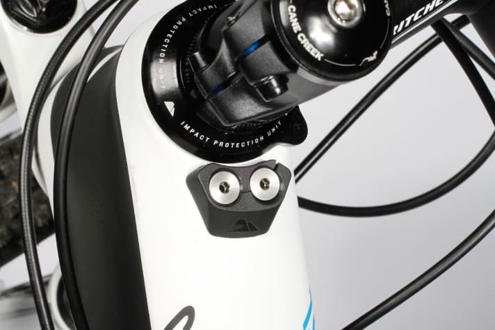   The lug in the headset cap and the stop prevent the brake levers from hitting the top tube in the event of a fall.