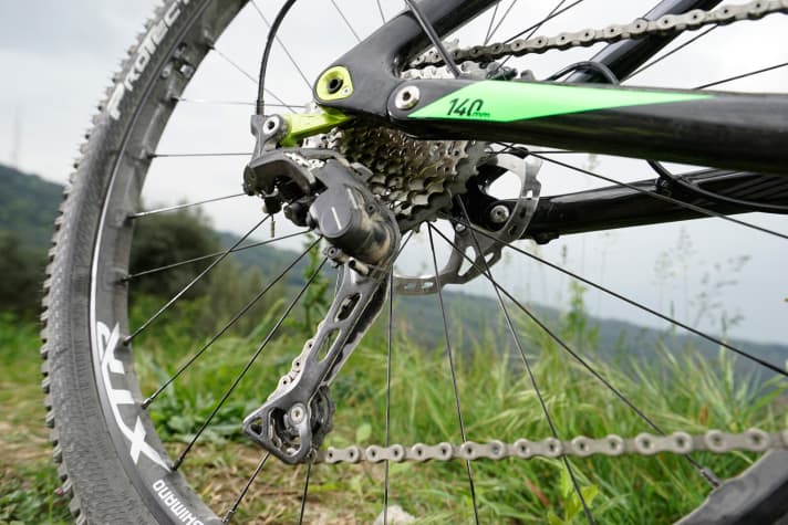   XT rear derailleur with increased chain tension.
