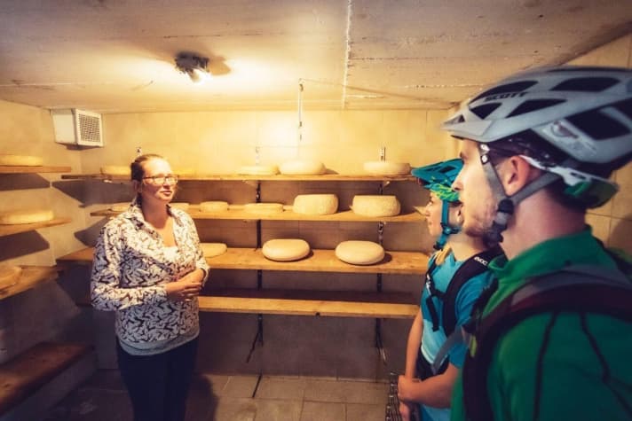   Maria Rettenbacher shows where the cheese is stored for maturing.