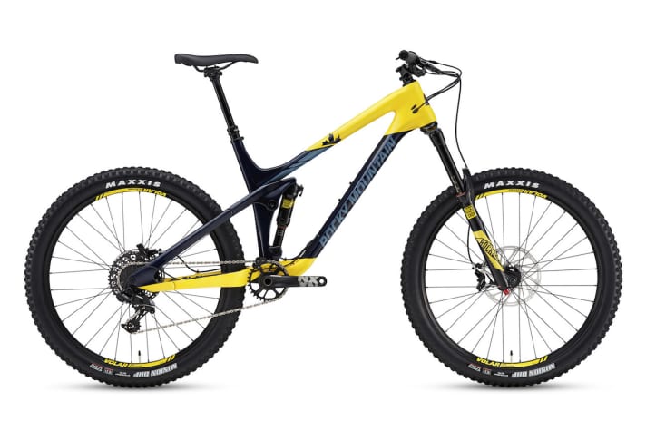  Rocky Mountain Slayer 730 MSL: Das Einstiegsmodell schaltet mit Sram NX, bremst mit Guide R und federt mit Rock Shox Yari-Gabel. Abgebildet ist die Farbvariante Gelb/Blau glänzend.    