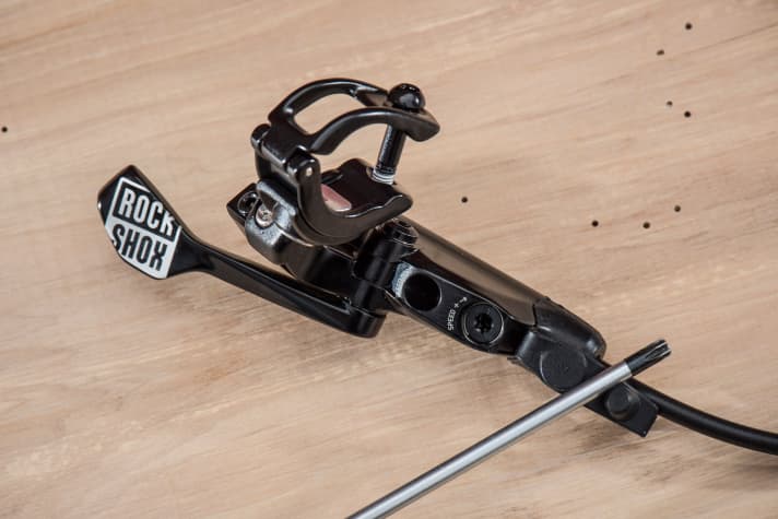   The speed can be adjusted on the new Rock Shox Reverb lever using a T25 Torx. The bleed port is located directly next to it.