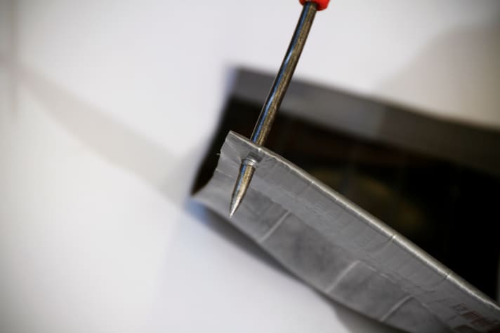   ... and pierce two holes so that it can be attached to the triple clamp with cable ties.