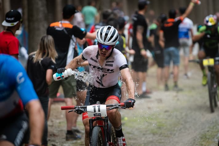   Anton Cooper keeps cool with a water bottle. The New Zealander missed out on victory by a hair's breadth after a great race.