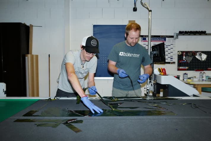   The computer-controlled cutter cuts the individual parts for the frame from the carbon mats within a few minutes. The Stoll R1 that Bernd receives consists of 80 pieces of carbon - each specially tailored to its intended use and its place on the frame. "These are rather few parts compared to frames from the Far East, some of which consist of many more individual parts. The great art of carbon frame construction is to manage with as few parts as possible," explains Christian.  