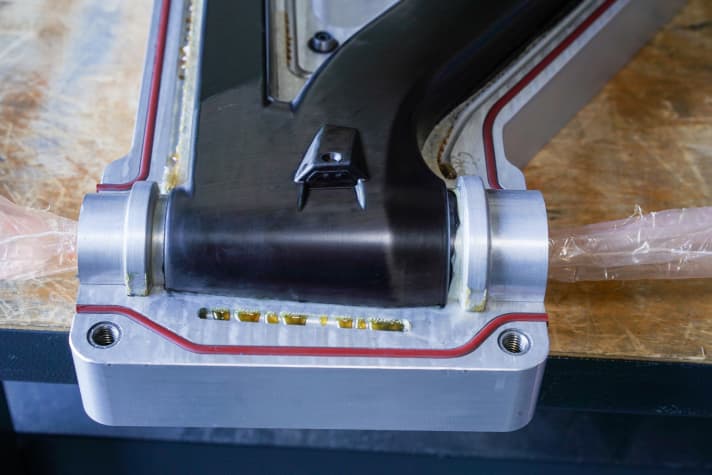   It takes eight to nine hours to place the carbon mats in the mould, then the frame is baked in an autoclave at 120 degrees for three hours. This is what it looks like when the upper part of the baking mould is removed.