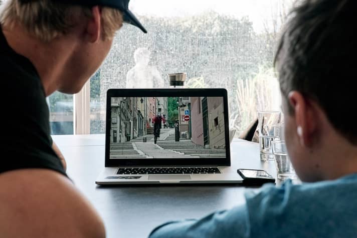  It takes a lot of steps to get an action clip like "Wibmer's Law" up and running on YouTube. Wibmer (left) and fan Fabian enjoy the finished product.